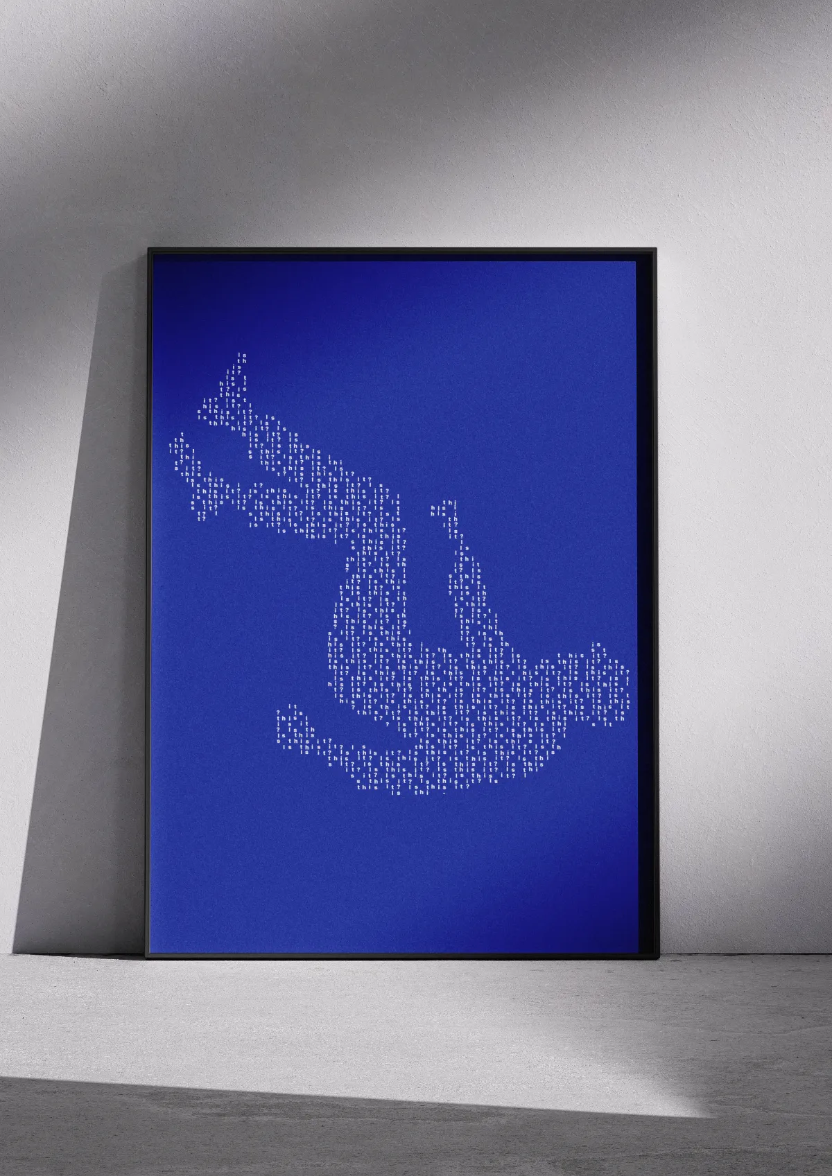 Typographic poster "The Fall", white on blue, framed on a wall. A falling figure.